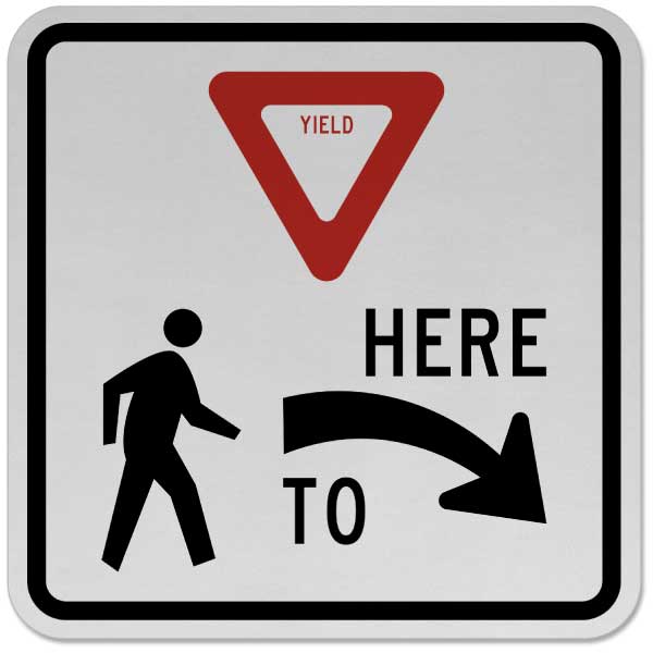 Yield Here to Pedestrians Sign