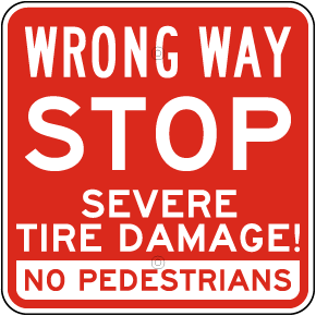 Wrong Way Severe Tire Damage Sign