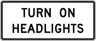 Turn On Headlights Sign