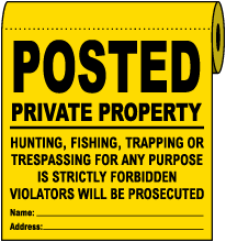 Yellow Posted Private Property Signs On a Roll
