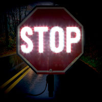 Night time hand held stop sign
